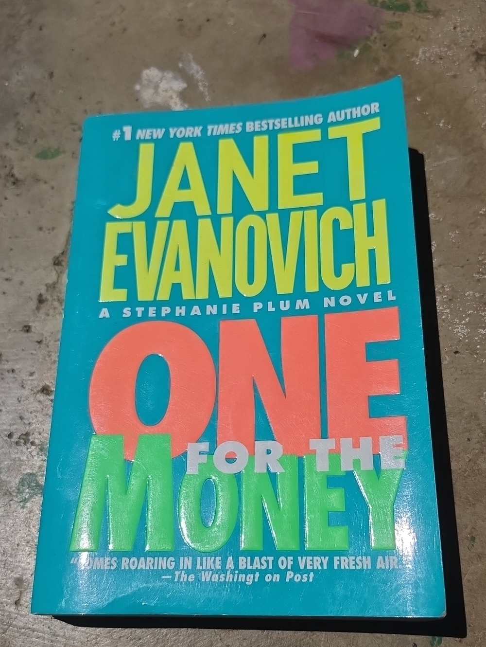 Paperbacks Janet Evanovich Teal Book with Yellow, Coral, and Lime Text